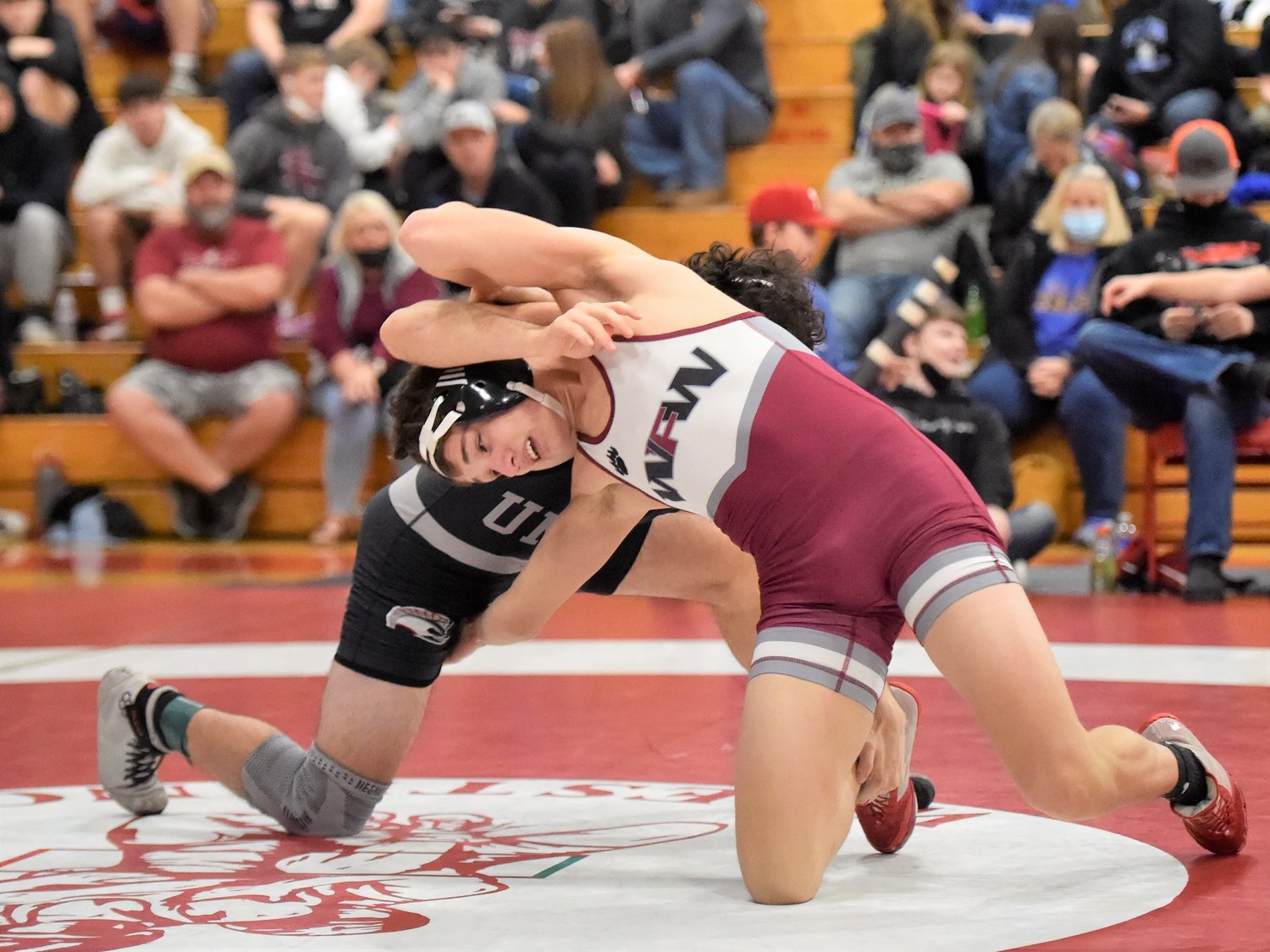 W.F. West’s Ty Foister flips positions with a Union wrestler on Saturday, Jan. 8, at Castle Rock High School.